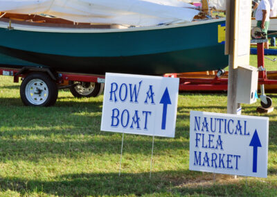 2 signs: row a boat and nautical flea market