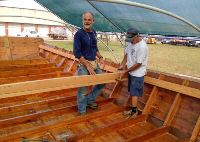 Dan Pecore and Mike Oldani stand inside the hull.