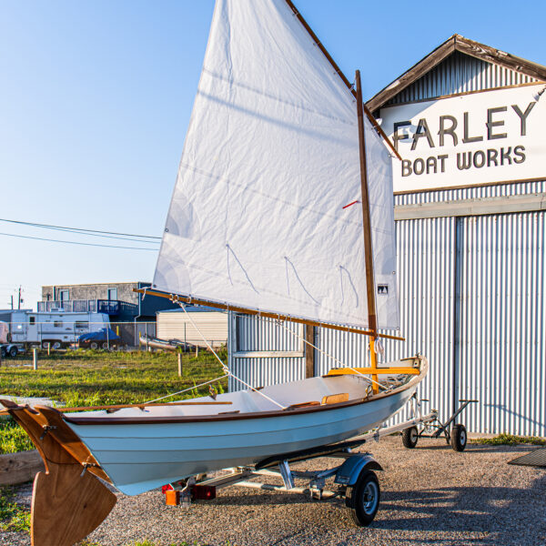 Northeaster Dory sailboat in front of Farley Boat Works